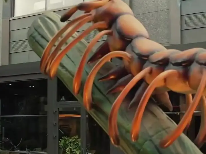 A giant centipede climbing a branch