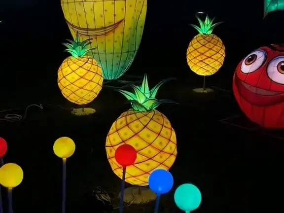 Smiling lantern fruits and pineapples