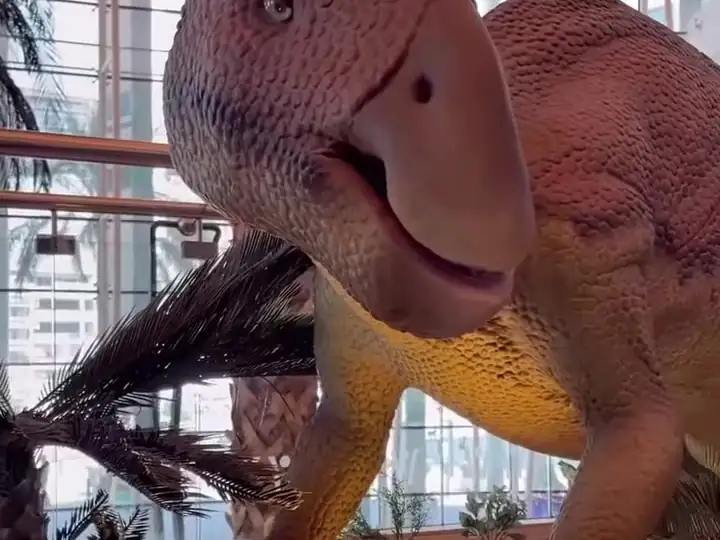 A dinosaur mother with her young inside the mall