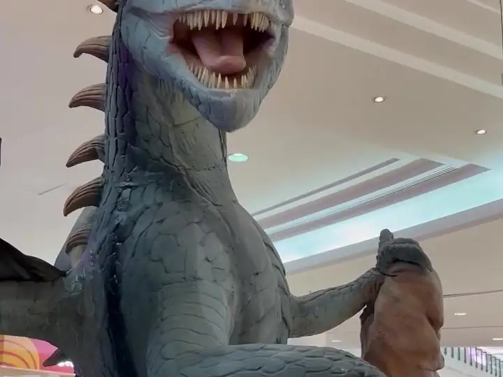 A blue dragon roaring inside the mall